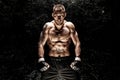 Mixed martial artist posing on a black background. Concept of mma, ufc, thai boxing, classic boxing