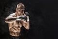Mixed martial artist posing on a black background. Concept of mma, ufc, thai boxing, classic boxing
