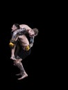 Mixed martial artists fighting on black background Royalty Free Stock Photo