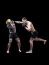 Mixed martial artists fighting on black background