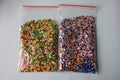 Mixed multi-colored diamonds mosaic. two bags with beads Royalty Free Stock Photo