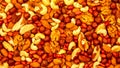Mixed nuts assortment featuring almonds, cashews, walnuts, and peanuts on a vibrant background Royalty Free Stock Photo