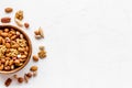 Mixed nuts in bowl - healthy snack - on white background top-down frame copy space Royalty Free Stock Photo