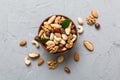 mixed nuts in bowl. Mix of various nuts on colored background. pistachios, cashews, walnuts, hazelnuts, peanuts and Royalty Free Stock Photo