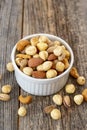 Mixed nuts on wood floor. Organic and fresh nuts Royalty Free Stock Photo