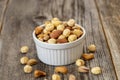 Mixed nuts on wood floor. Organic and fresh nuts Royalty Free Stock Photo