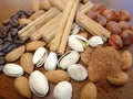 Mixed nuts, cinnamon & coffee Royalty Free Stock Photo