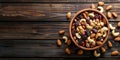 Mixed nuts and dried fruits in wooden bowl on wooden background. Healthy snack, mix of organic nuts and dry fruits Royalty Free Stock Photo