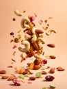 Mixed nuts flying in air on orange background. Healthy food concept.