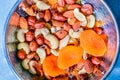 Mixed nuts: hazelnuts, cashew, almonds, raisins and dried apricots in authentic oriental copper plate