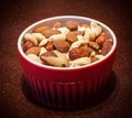 Mixed nuts in red bowl