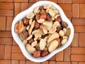 Mixed nuts in a white bowl Royalty Free Stock Photo