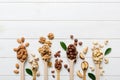 mixed nuts in white wooden spoon. Mix of various nuts on colored background. pistachios, cashews, walnuts, hazelnuts Royalty Free Stock Photo