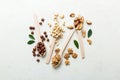 mixed nuts in white wooden spoon. Mix of various nuts on colored background. pistachios, cashews, walnuts, hazelnuts Royalty Free Stock Photo