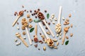 mixed nuts in white wooden spoon. Mix of various nuts on colored background. pistachios, cashews, walnuts, hazelnuts Royalty Free Stock Photo