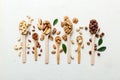 mixed nuts in white wooden spoon. Mix of various nuts on colored background. pistachios, cashews, walnuts, hazelnuts Royalty Free Stock Photo