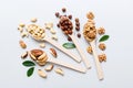 mixed nuts in white wooden spoon. Mix of various nuts on colored background. pistachios, cashews, walnuts, hazelnuts Royalty Free Stock Photo