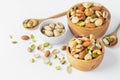 Mixed nuts in wooden bowl isolated on white background Royalty Free Stock Photo