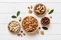 mixed nuts in wooden bowl. Mix of various nuts on colored background. pistachios, cashews, walnuts, hazelnuts, peanuts Royalty Free Stock Photo