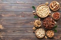 mixed nuts in wooden bowl. Mix of various nuts on colored background. pistachios, cashews, walnuts, hazelnuts, peanuts Royalty Free Stock Photo