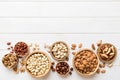 mixed nuts in wooden bowl. Mix of various nuts on colored background. pistachios, cashews, walnuts, hazelnuts, peanuts Royalty Free Stock Photo