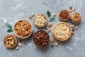 mixed nuts in wooden bowl. Mix of various nuts on colored background. pistachios, cashews, walnuts, hazelnuts, peanuts Royalty Free Stock Photo