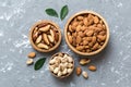 mixed nuts in wooden bowl. Mix of various nuts on colored background. pistachios, cashews, walnuts, hazelnuts, peanuts Royalty Free Stock Photo