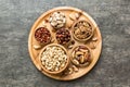 mixed nuts in wooden bowl. Mix of various nuts on colored background. pistachios, cashews, walnuts, hazelnuts, peanuts Royalty Free Stock Photo