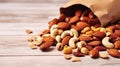 Mixed nuts in wooden bowl and scattered on table. copy space, top view. Generative AI Royalty Free Stock Photo