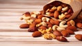 Mixed nuts in wooden bowl and scattered on table. copy space, top view. Generative AI Royalty Free Stock Photo