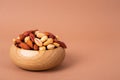 Different kinds of organic nuts in wooden bowl Royalty Free Stock Photo