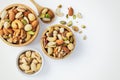 Mixed nuts in wooden bowl on white background, top view Royalty Free Stock Photo