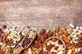 Mixed nuts on wooden table top view. Healthy food and snack Royalty Free Stock Photo