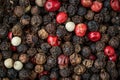 Mixed peppercorns background. Different colored peppercorns Royalty Free Stock Photo