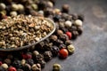 Mixed peppercorns on the rustic background Royalty Free Stock Photo