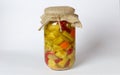 Green tomatoes, paprika, cucumbers, pickled carrots in a transparent jar Royalty Free Stock Photo