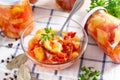 Mixed pickled vegetables in glass jar. Vegetable salad for the winter Royalty Free Stock Photo