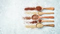 Mixed quinoa in spoons on wooden kitchen table top view. Royalty Free Stock Photo