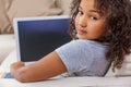 Mixed Race African American Girl Child Using Laptop or Tablet Computer Royalty Free Stock Photo