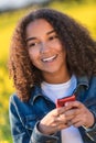 Mixed Race African American Girl Teenager on Cell Phone Royalty Free Stock Photo