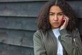 Mixed Race African American Girl Teenager on Cell Phone Royalty Free Stock Photo