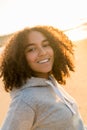 Mixed Race African American Girl Teenager Smiling on Beach at Sunset Royalty Free Stock Photo