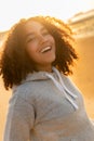 Mixed Race African American Girl Teenager Smiling on Beach at Sunset Royalty Free Stock Photo