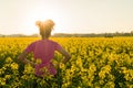 Mixed Race African American Girl Teenager Standing In Yellow Flowers Royalty Free Stock Photo