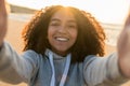 Mixed Race African American Girl Teenager Taking Selfie on Beach Royalty Free Stock Photo