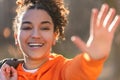 Mixed Race African American Girl Teenager Waving and Laughing in Evening Sunshine Royalty Free Stock Photo