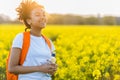 Mixed Race African American Girl Teenager In Yellow Flowers Royalty Free Stock Photo