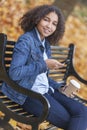 Mixed Race African American Teenager Woman Coffee Texting Royalty Free Stock Photo