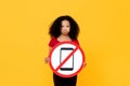 Mixed race African girl showing no mobile phone usage sign