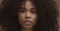 Mixed race black woman portrait with big afro hair, curly hair